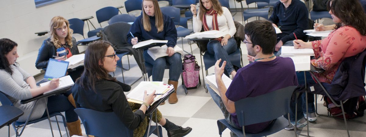 Students engaged in conversation in class.